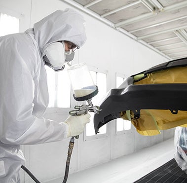 Collision Center Technician Painting a Vehicle | Findlay Toyota Prescott in Prescott AZ